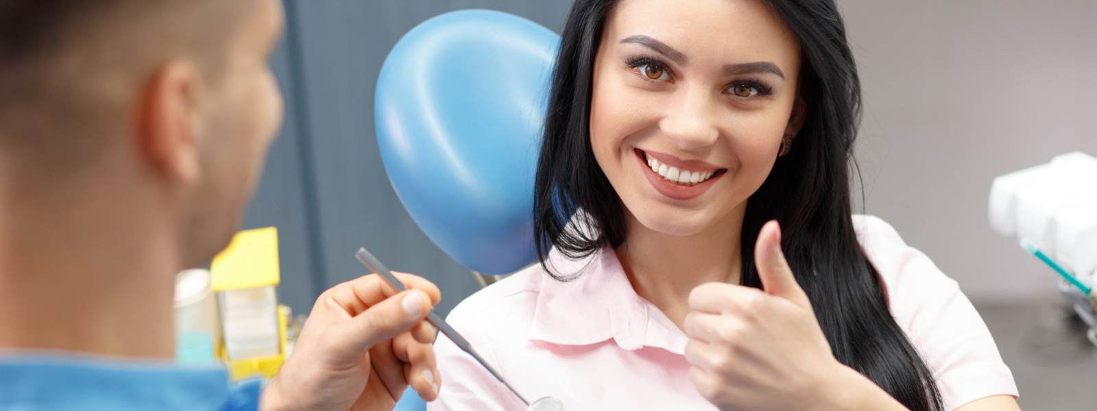 Satisfied patient thumbs up