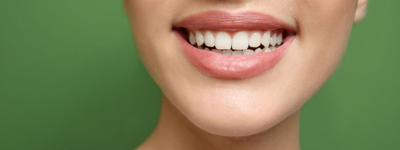 Smiling girl in green background