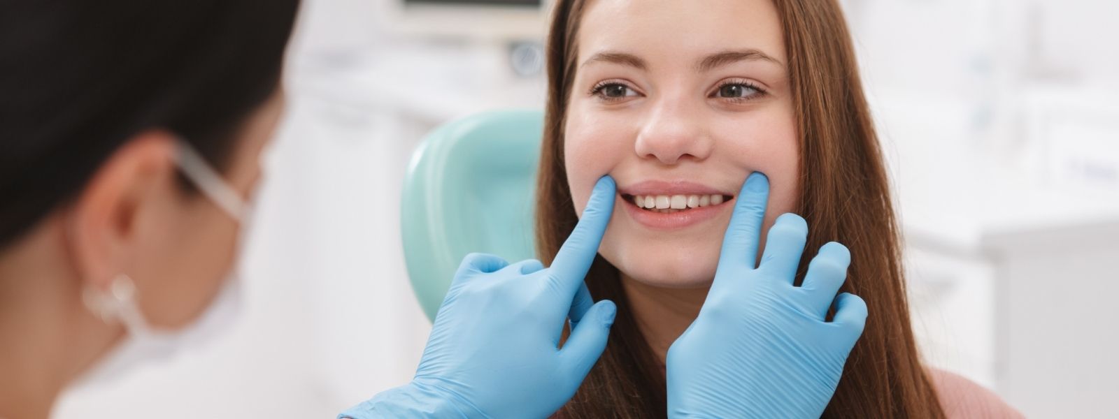 Dentist checking patient