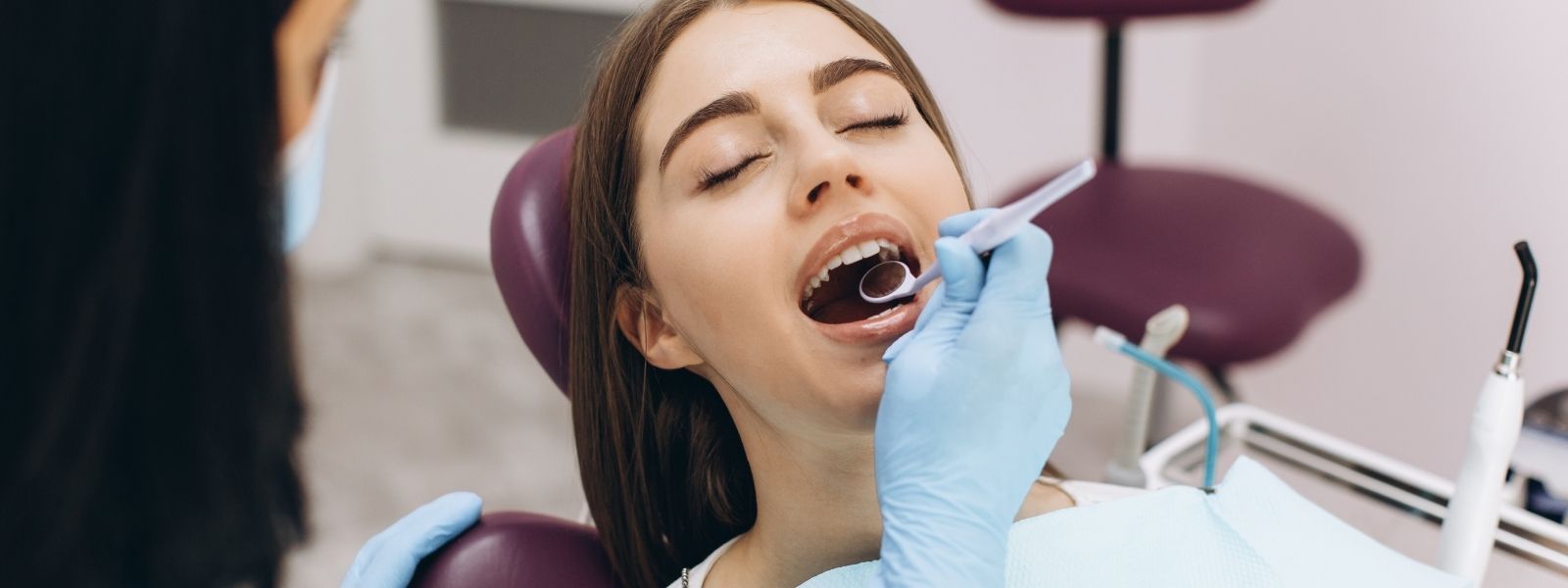 Dentist checking teeth