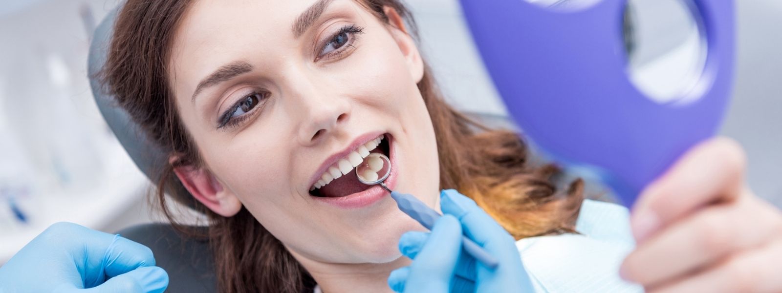 Girl getting procedure done at dentist