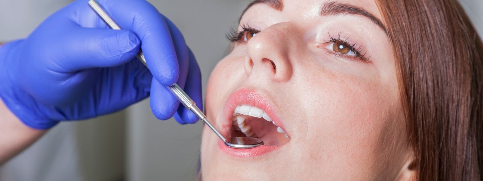 Close up of a girl getting Teeth Cleaned
