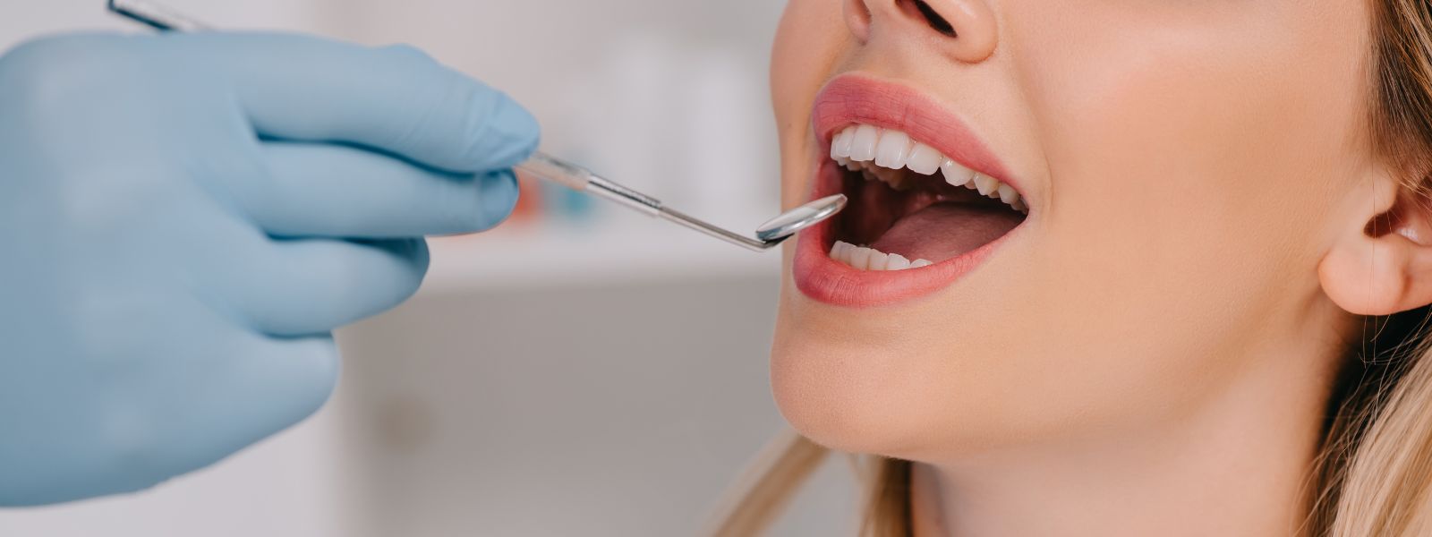 Close up of a Dentist checking teeth